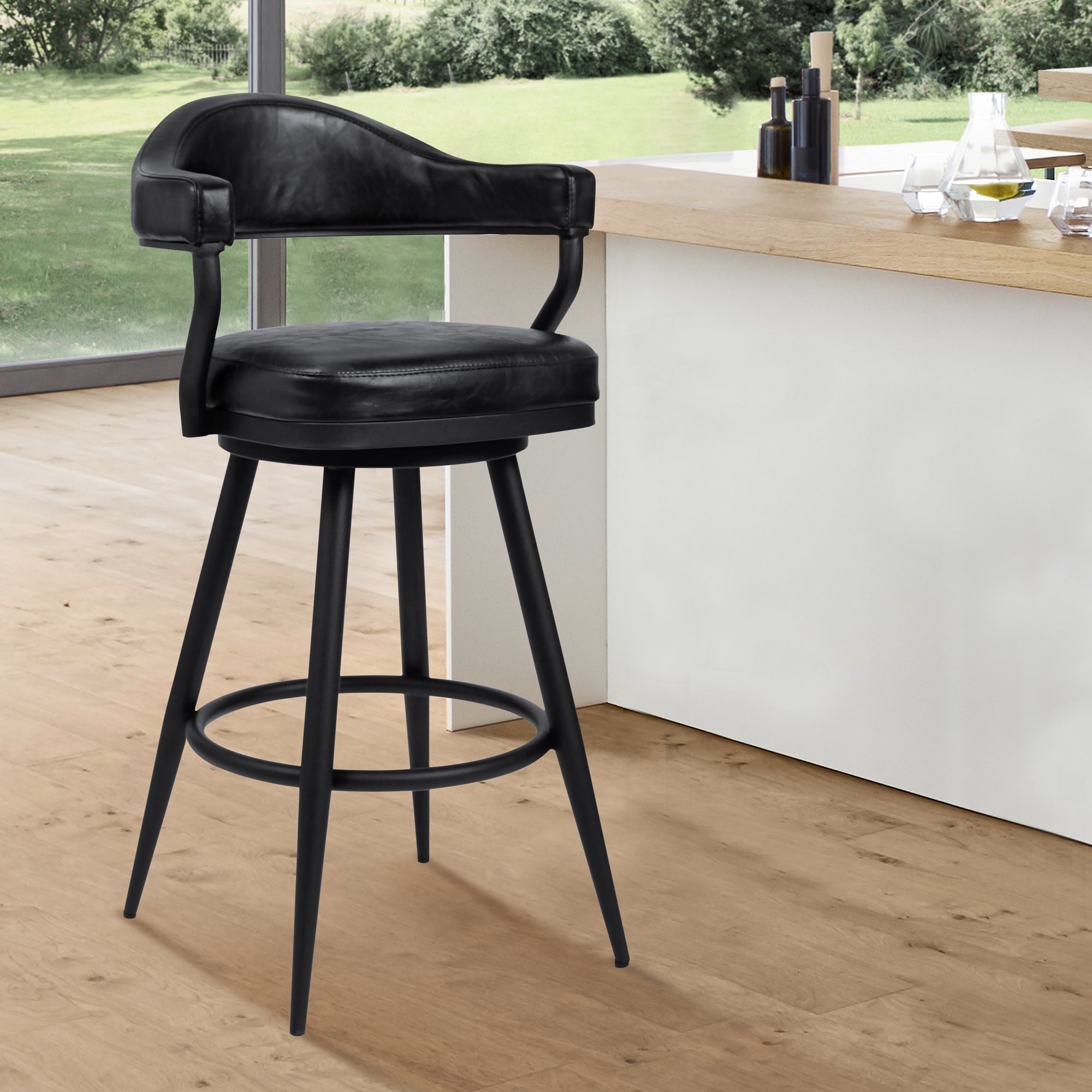 Justin Bar Stool in a Black Powder Coated Finish and Vintage Black Faux Leather